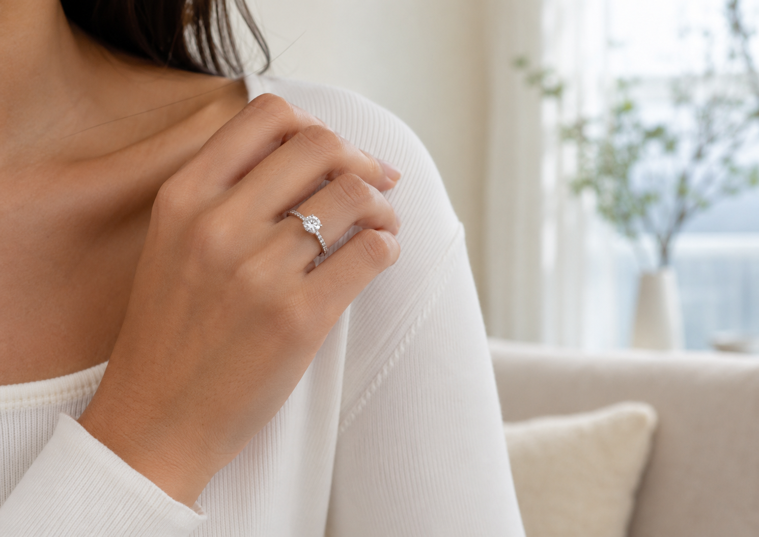 Woman wearing a silver moissanite ring for everyday wear