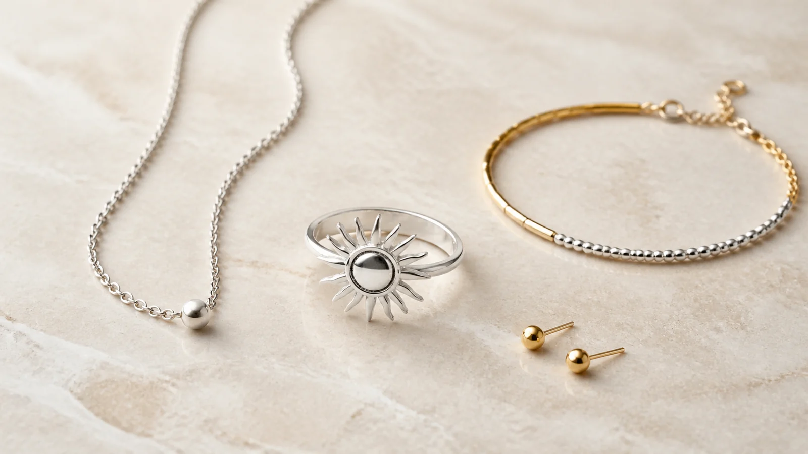 Generic silver-tone sunshine ring with a two-tone bracelet and quiet supporting jewelry