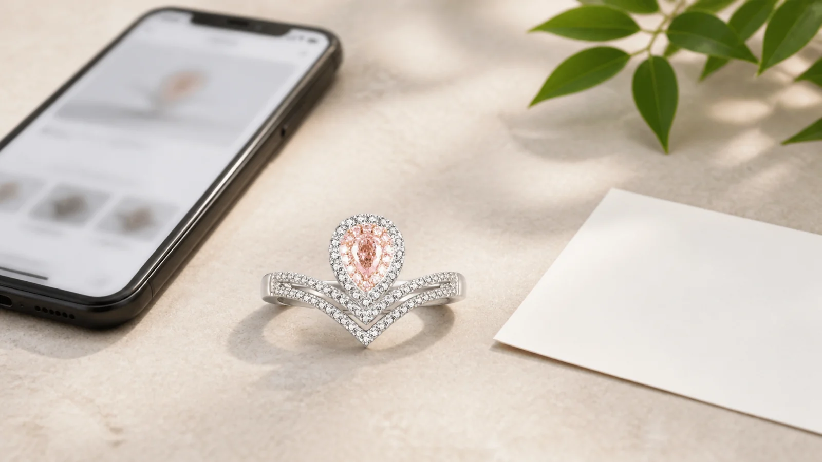 CJ076 statement ring beside a blurred product page and blank note card