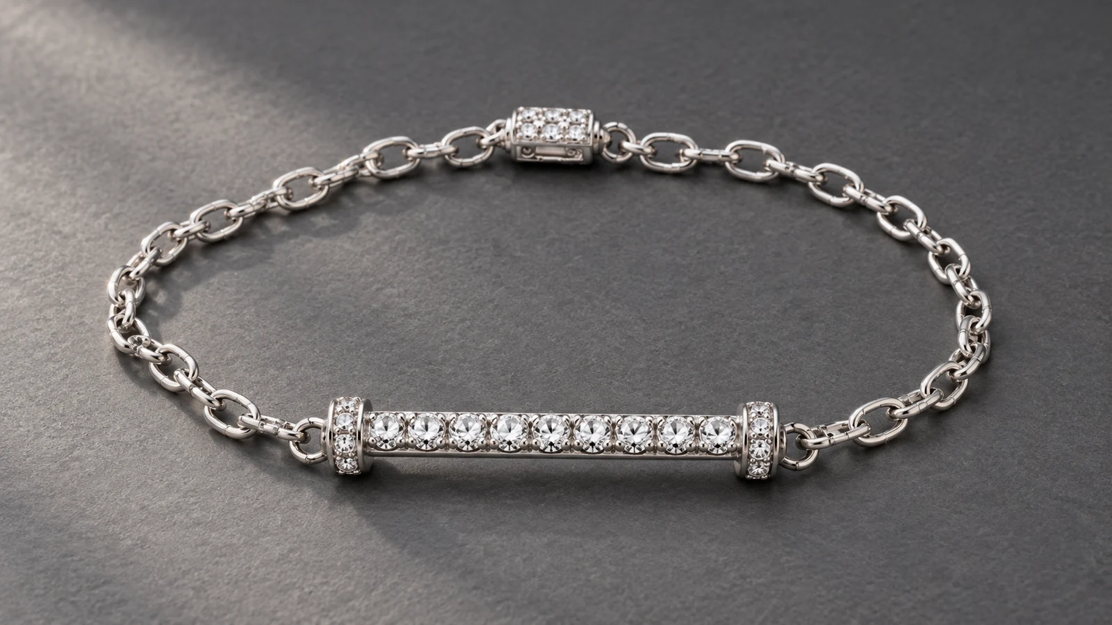 Half-tennis bracelet with structured stone bar and flexible chain