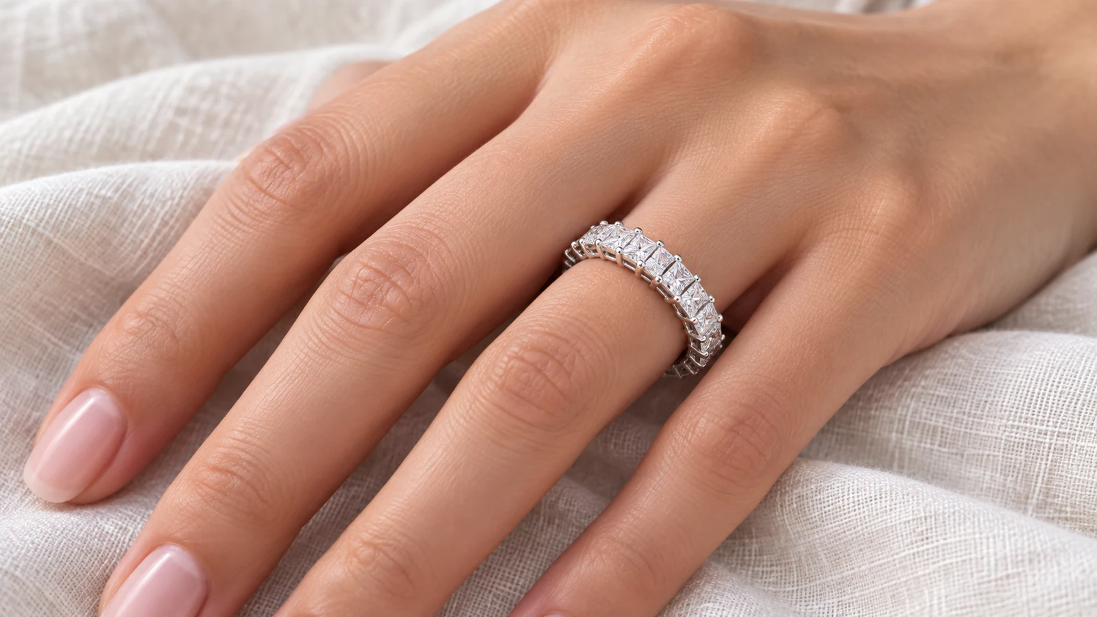 Princess-cut eternity band with a continuous row of square stones