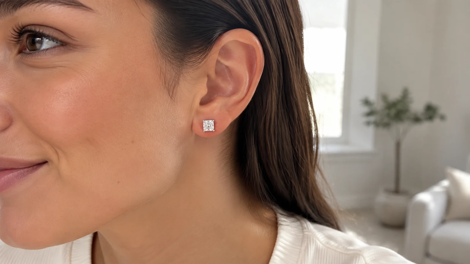 Woman wearing an MS0258 square cut stud earring in a bright everyday setting