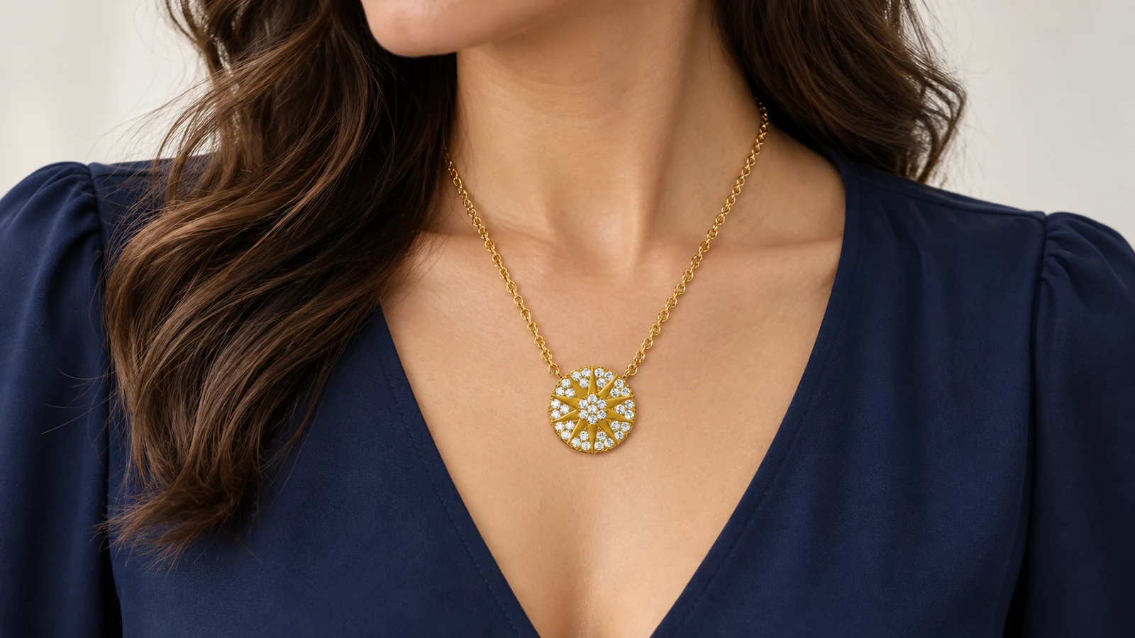 Sunburst moissanite sunshine pendant placed inside a navy V neckline