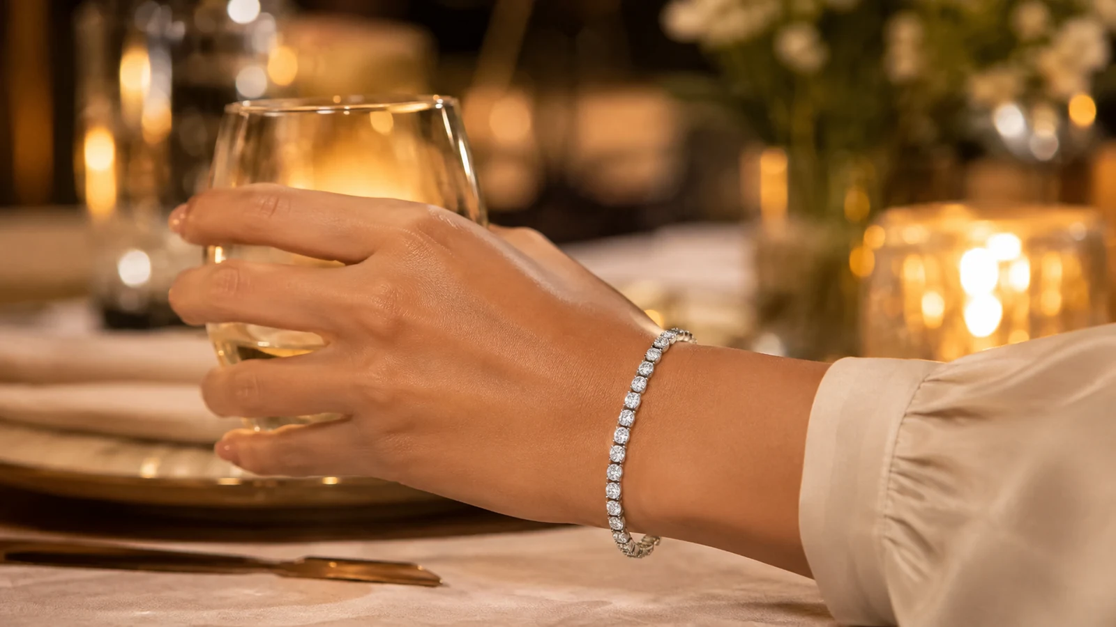 Elite round moissanite tennis bracelet worn at an evening celebration