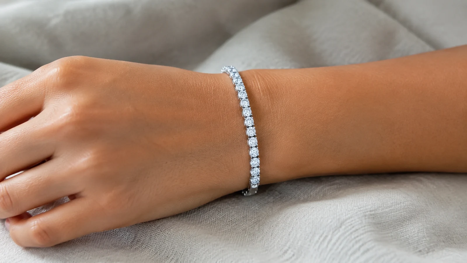Elite round moissanite tennis bracelet resting neatly on a wrist